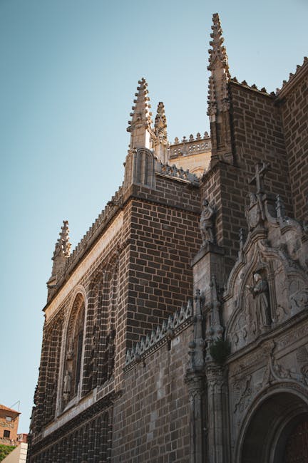 Historic Toledo buildings with stone facades and wrought iron balconies