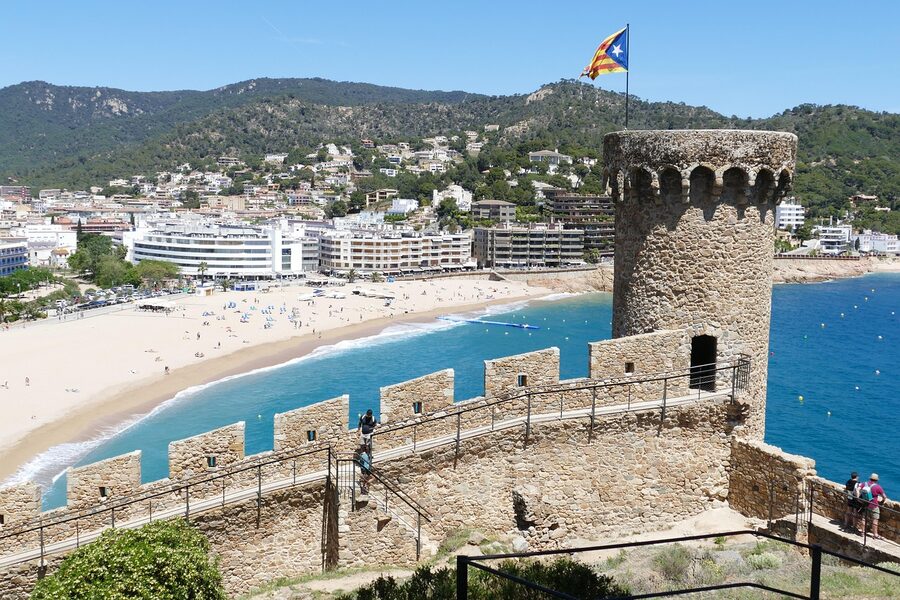 Castle tower and beach at Tossa de Mar on the Costa Brava coastline