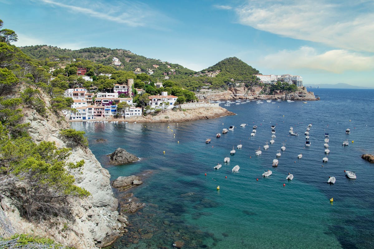 Beautiful view of Tossa de Mar coastline with sea and architecture