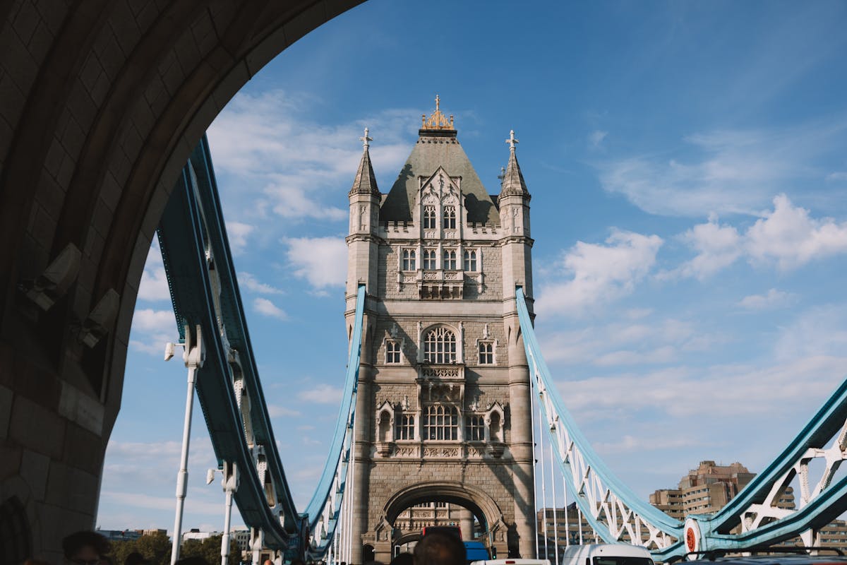 Tower Bridge in London spanning the Thames against a blue sky