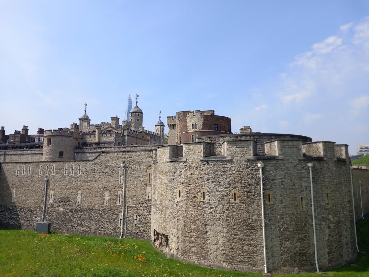 The Tower of London historic fortification under a clear blue sky