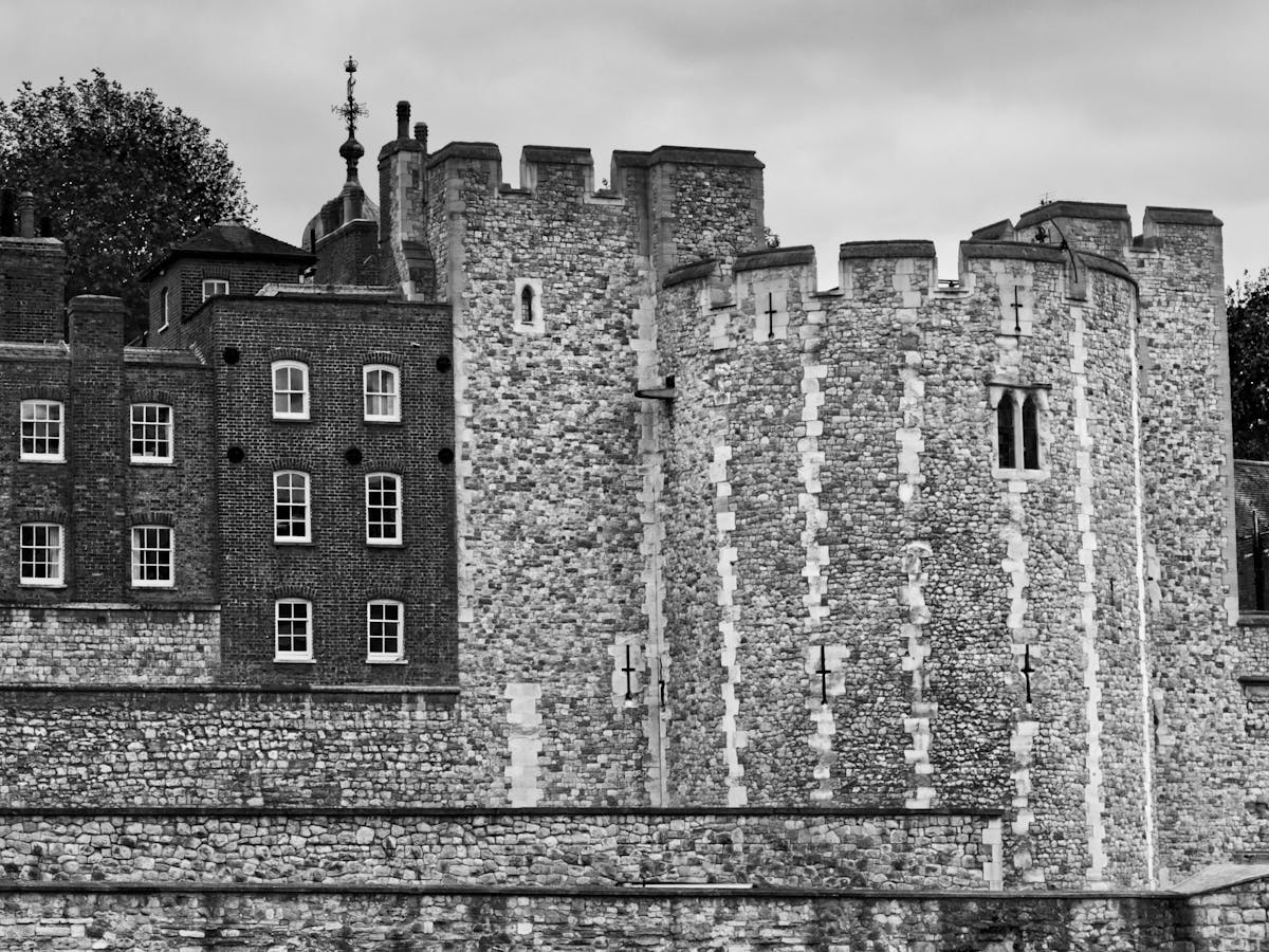 Black and white view of the Tower of London imposing stone curtain wall