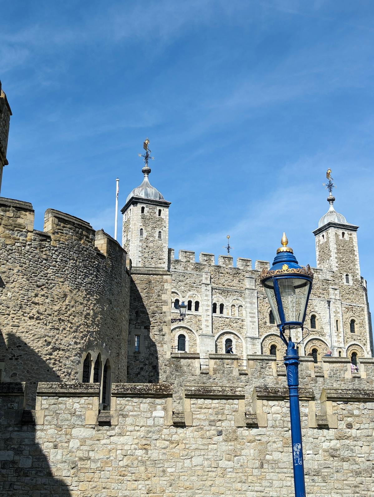 The historic Tower of London against a clear blue sky