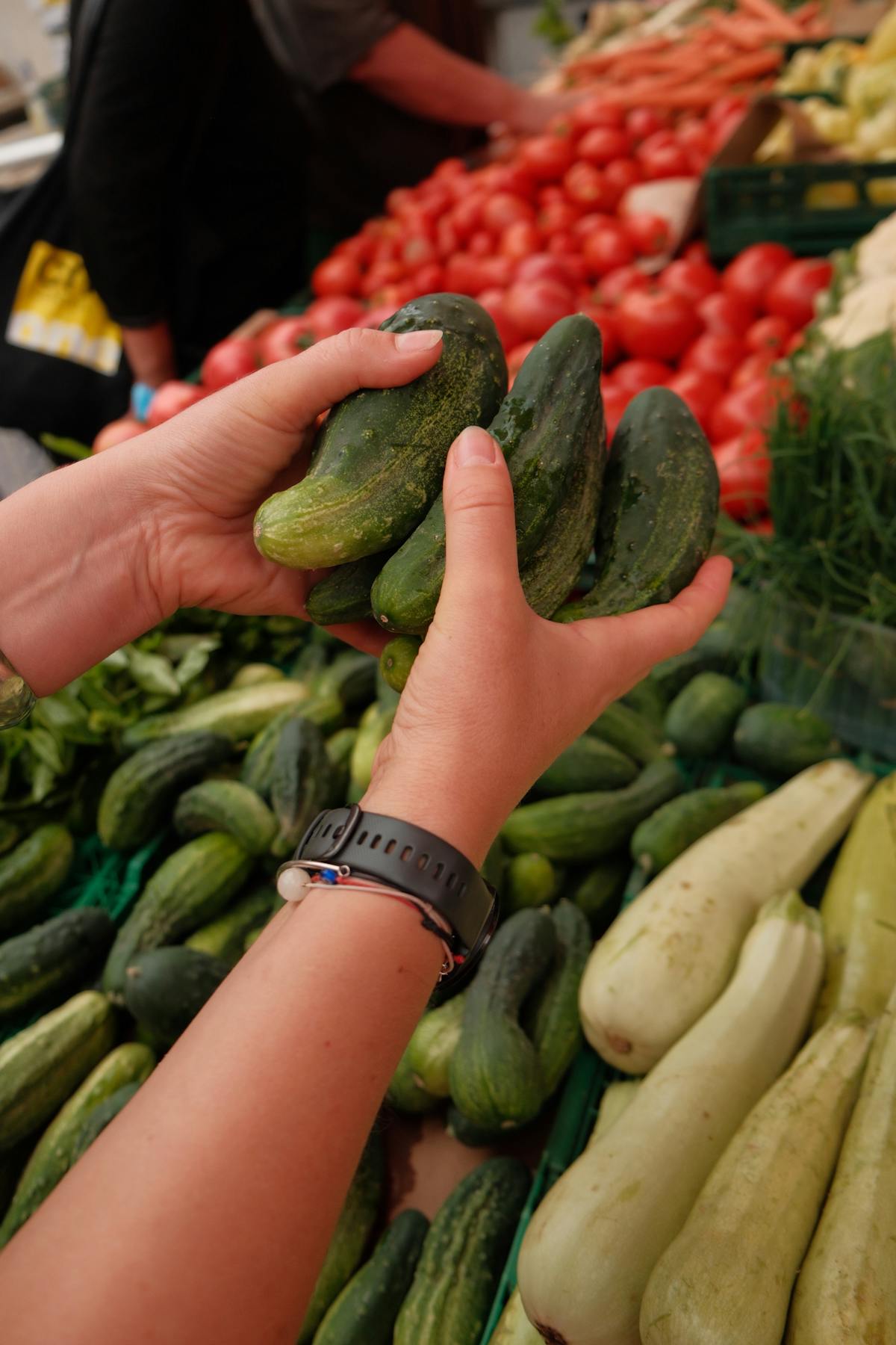 Woman selecting fresh produce at a Croatian farmers market