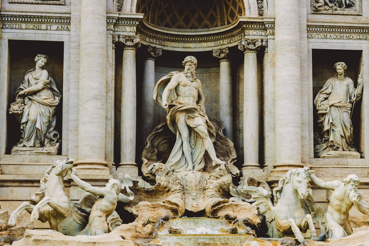 Baroque sculptures on the Trevi Fountain depicting Neptune and tritons