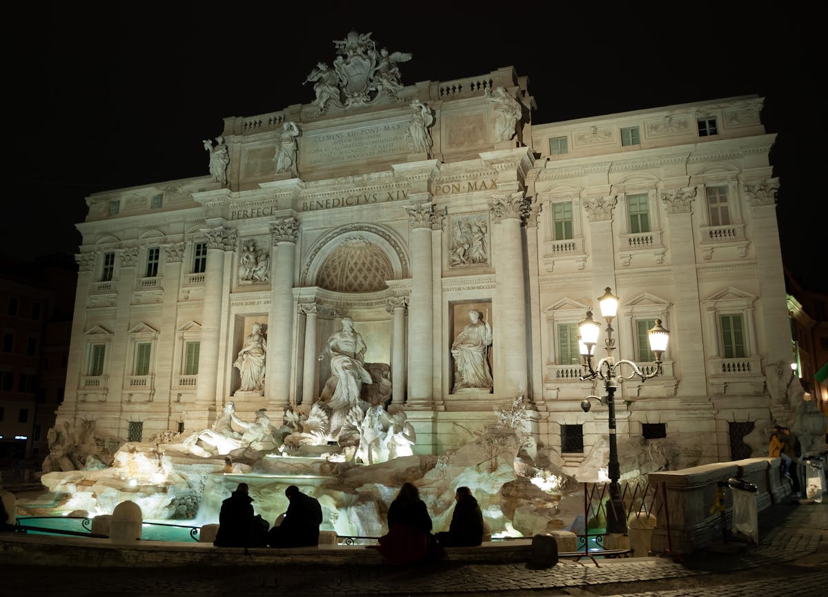 Trevi Fountain glowing in the evening light in Rome