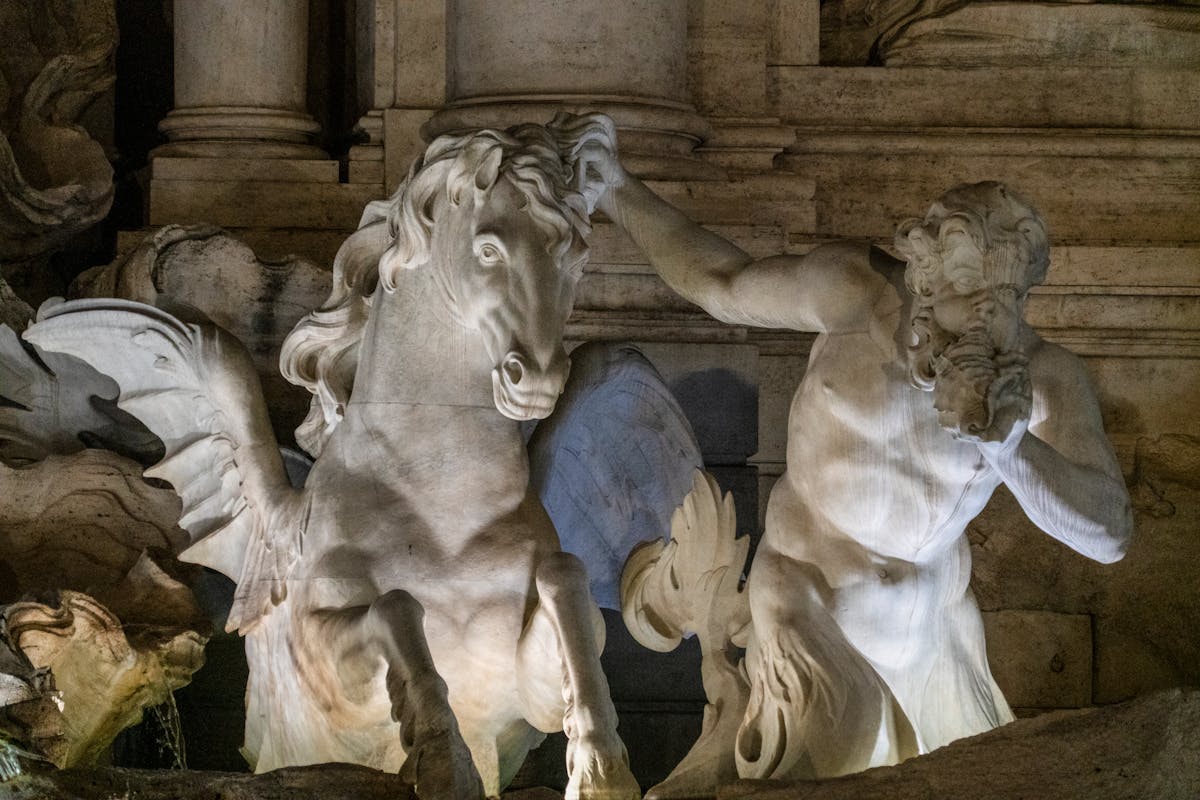 Dramatic night view of the Trevi Fountain in Rome