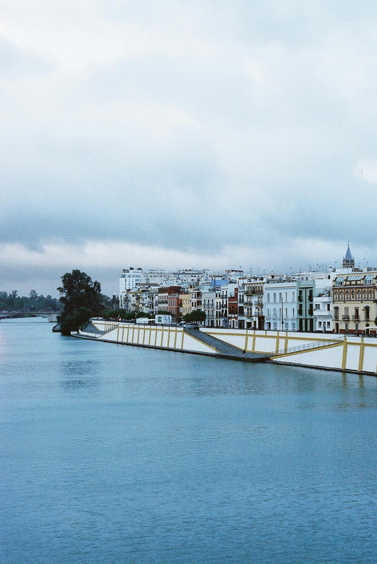 The Triana neighborhood and Guadalquivir River in Seville Spain on a cloudy day