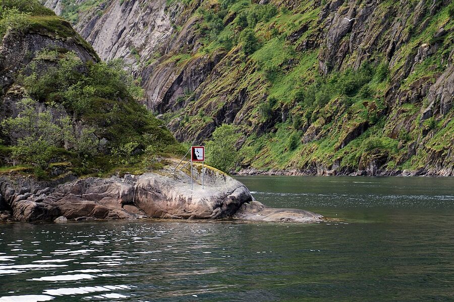 Cliff walls of Trollfjord rising sharply from the water