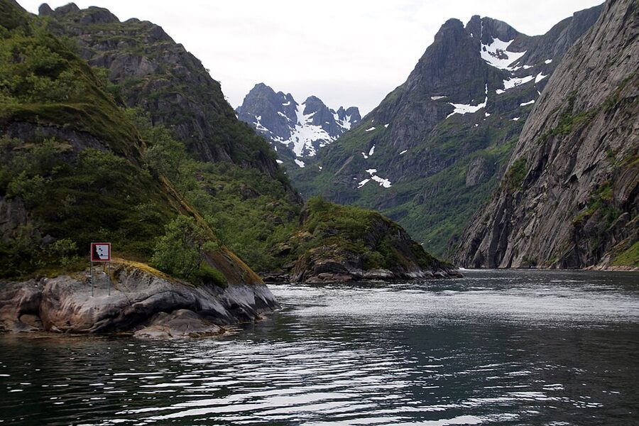 Interior of Trollfjord with steep mountain walls and dark water