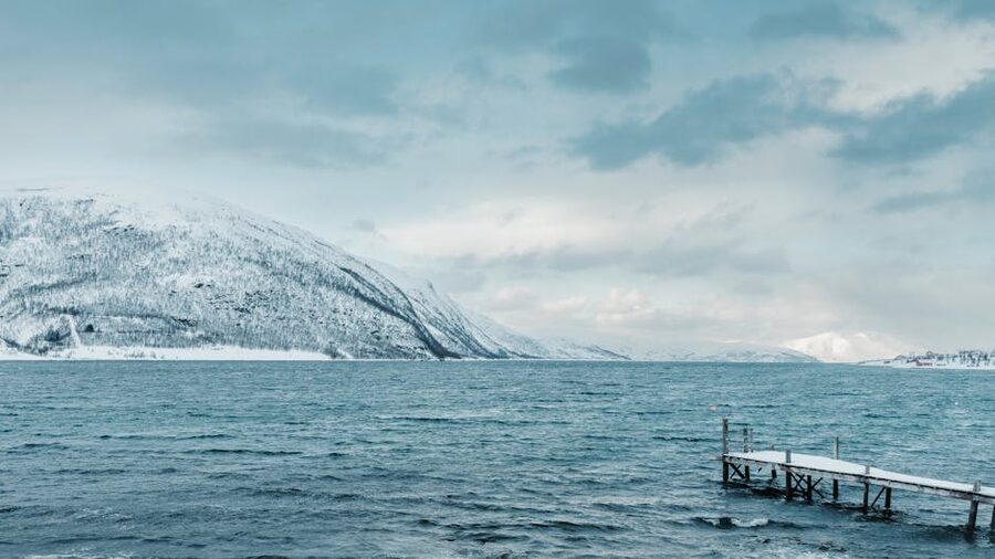 Tromso snowy fjord and dock area