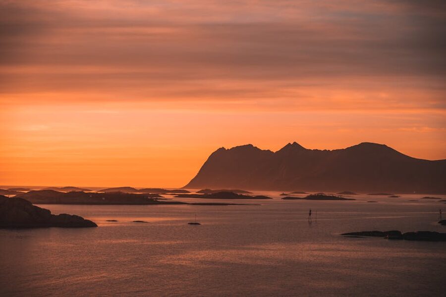 Tromso fjord sunset with mountain silhouettes