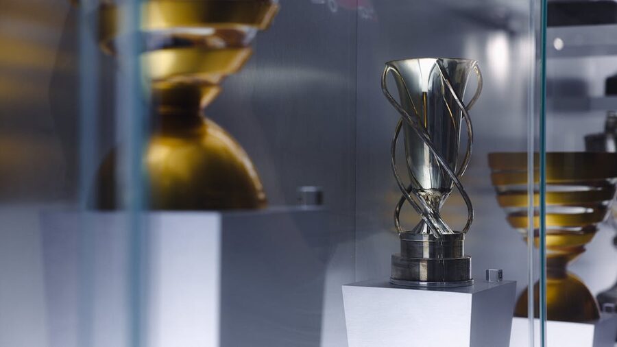 Trophy on display inside a glass case at a sports museum