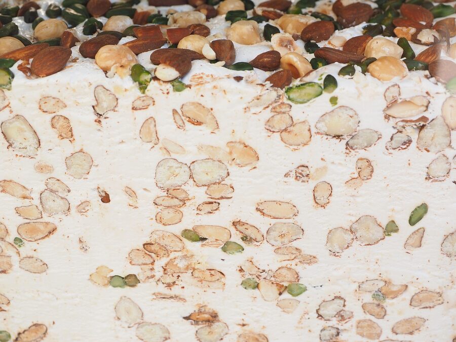 White nougat turron with almonds sliced and displayed