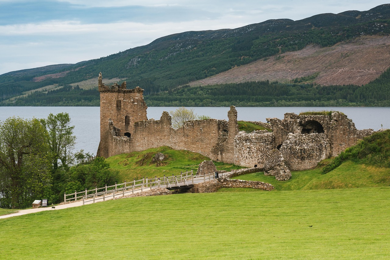 Urquhart Castle ruins with Loch Ness in the background on a cloudy day