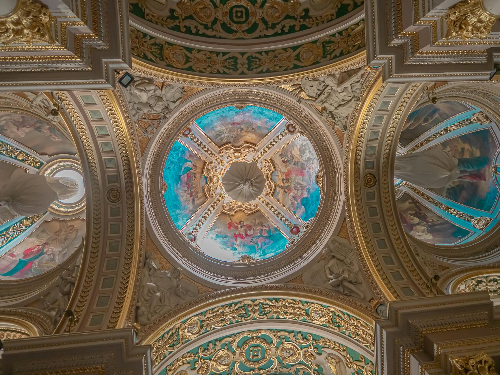 Ornate Baroque painted ceiling with gold embellishments in Maltese cathedral