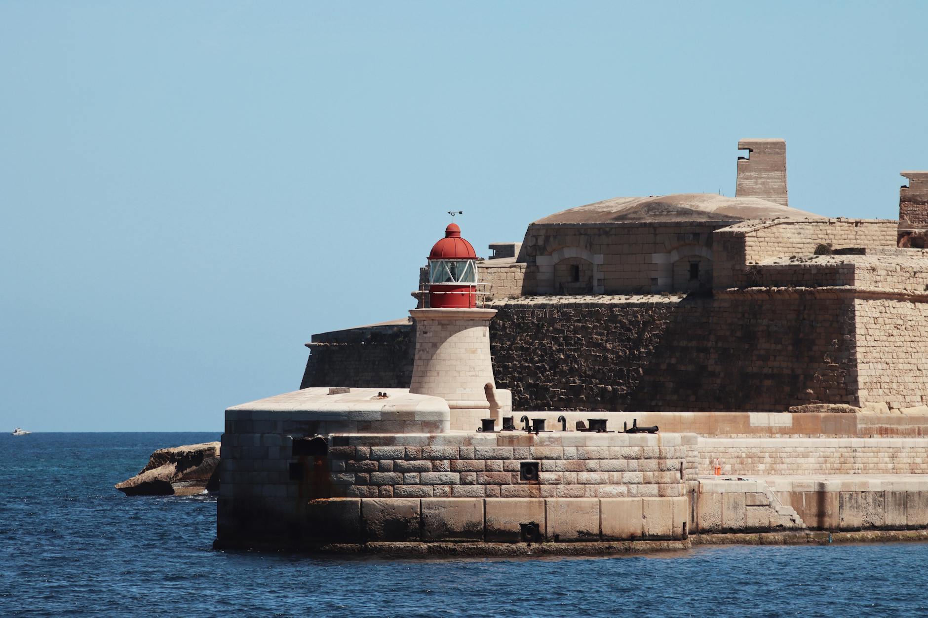 Grand Harbour fortifications and lighthouse in Valletta Malta