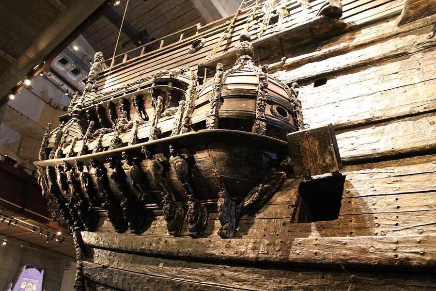 Visitors inside the Vasa Museum in Stockholm looking at the ship