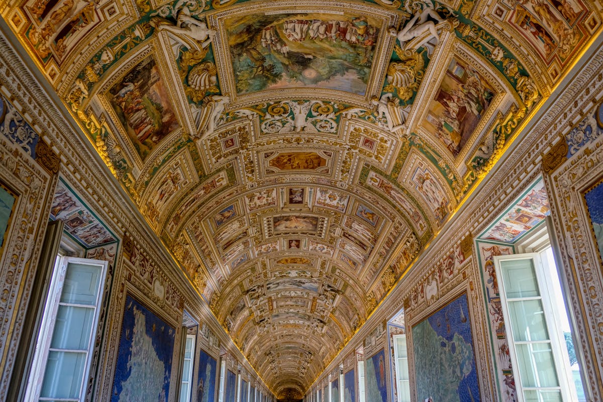 Richly decorated ceiling with Renaissance frescoes in a Vatican Museum corridor in Rome