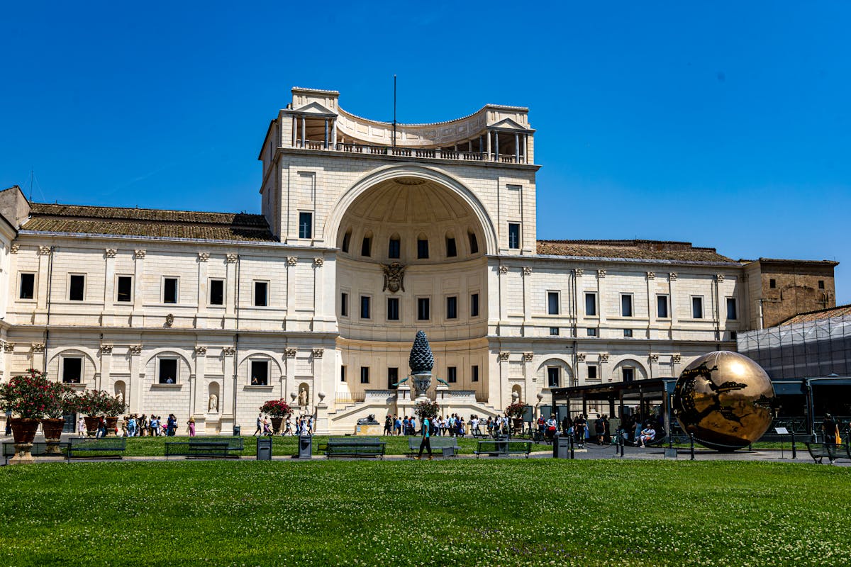 Courtyard of the Vatican Museums with crowd of visitors and historic architecture