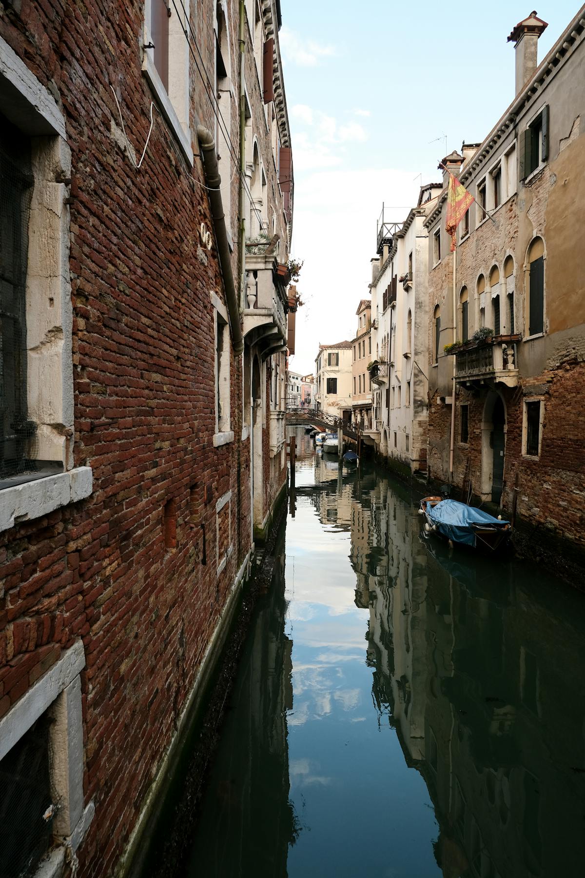 Historic buildings reflected in a Venice canal