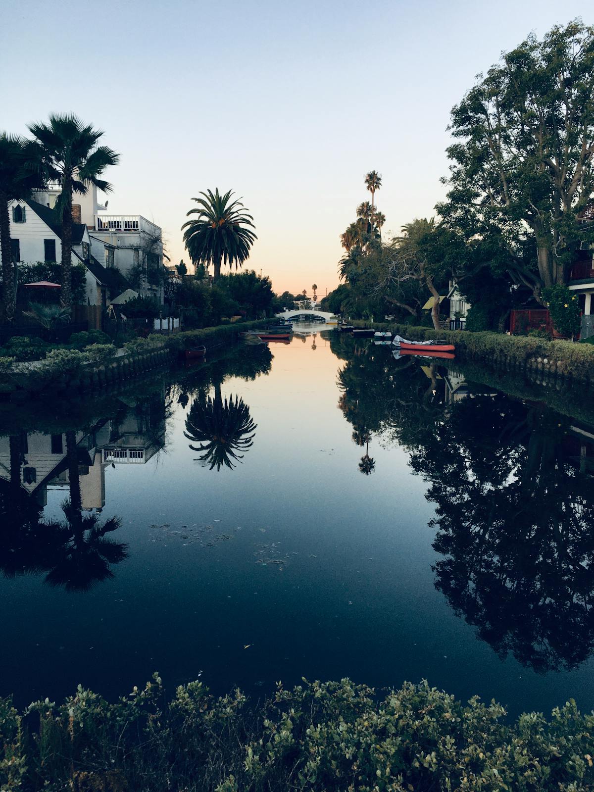 Venice canal at dawn with still water and reflections