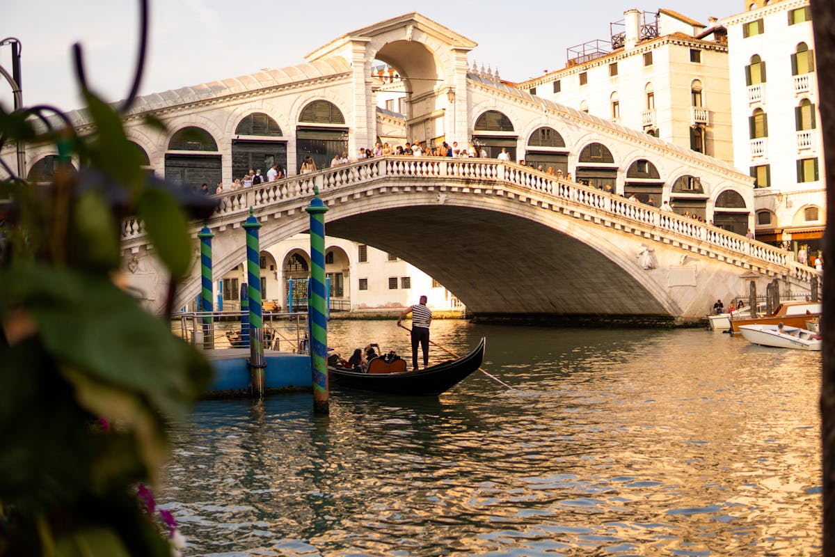 A gondola near the Rialto Bridge at night in Venice