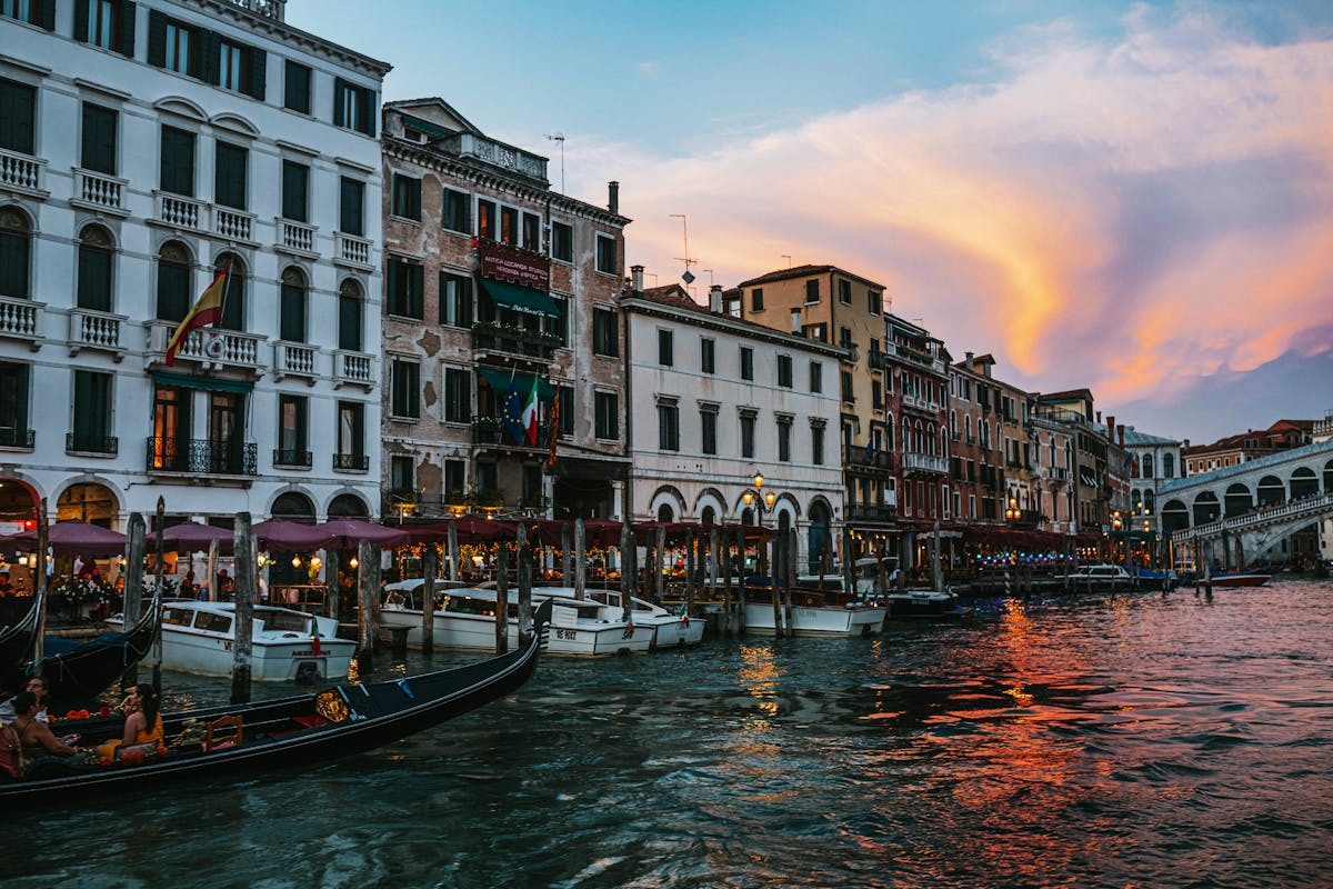 Rialto Bridge and Grand Canal at sunset in Venice Italy