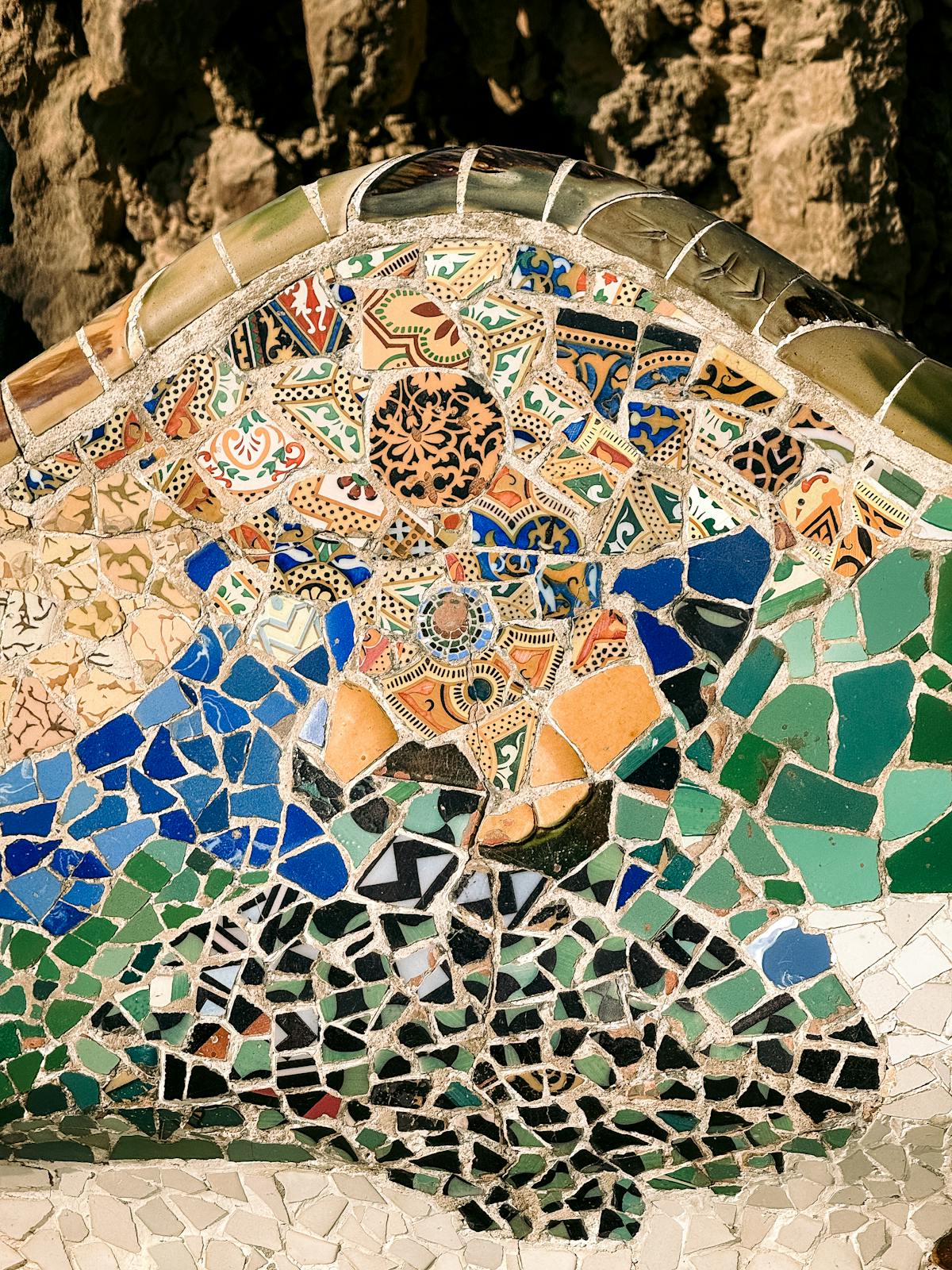 Colorful mosaic art in Park Guell showcasing Gaudi iconic artistic style