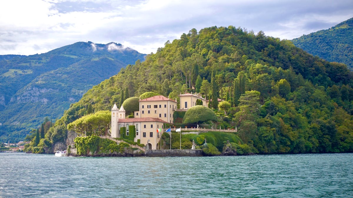 Villa del Balbianello on Lake Como surrounded by lush greenery