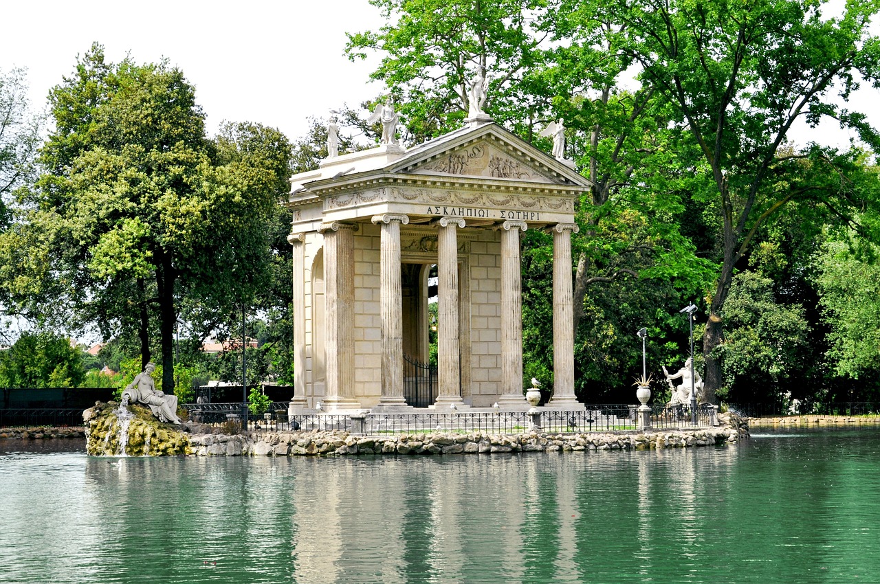 Scenic lake view surrounded by greenery in the Villa Borghese gardens in Rome Italy