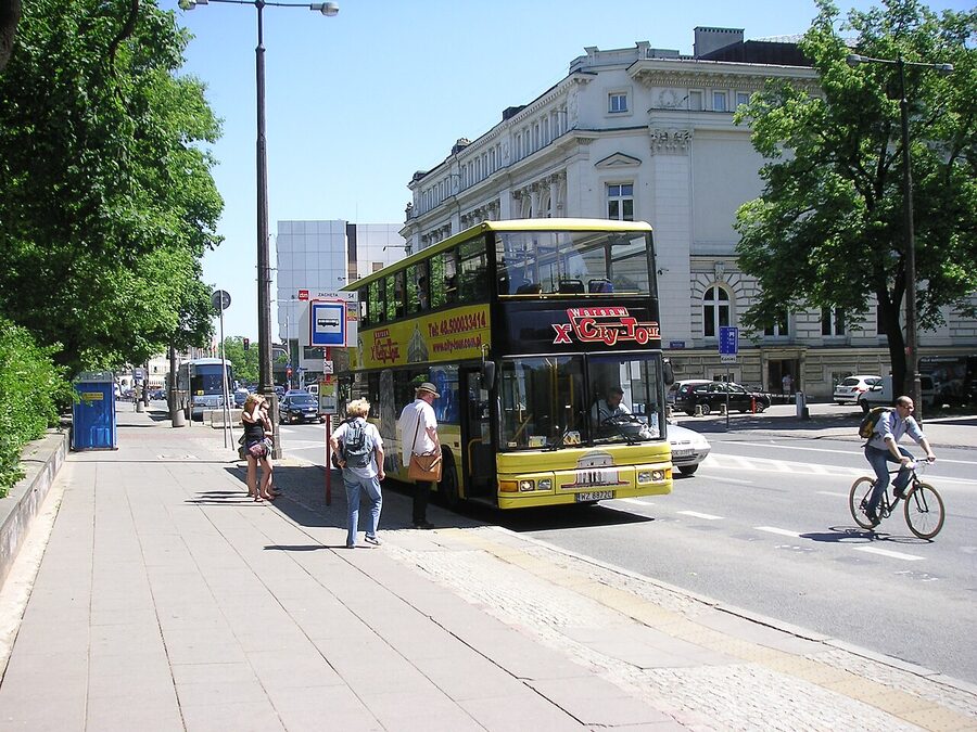 Red MAN SD double-decker City-Tour bus on a Warsaw street