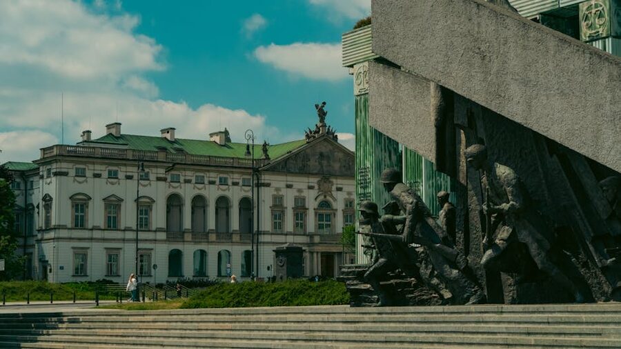 Warsaw Uprising Monument with historic building under blue sky
