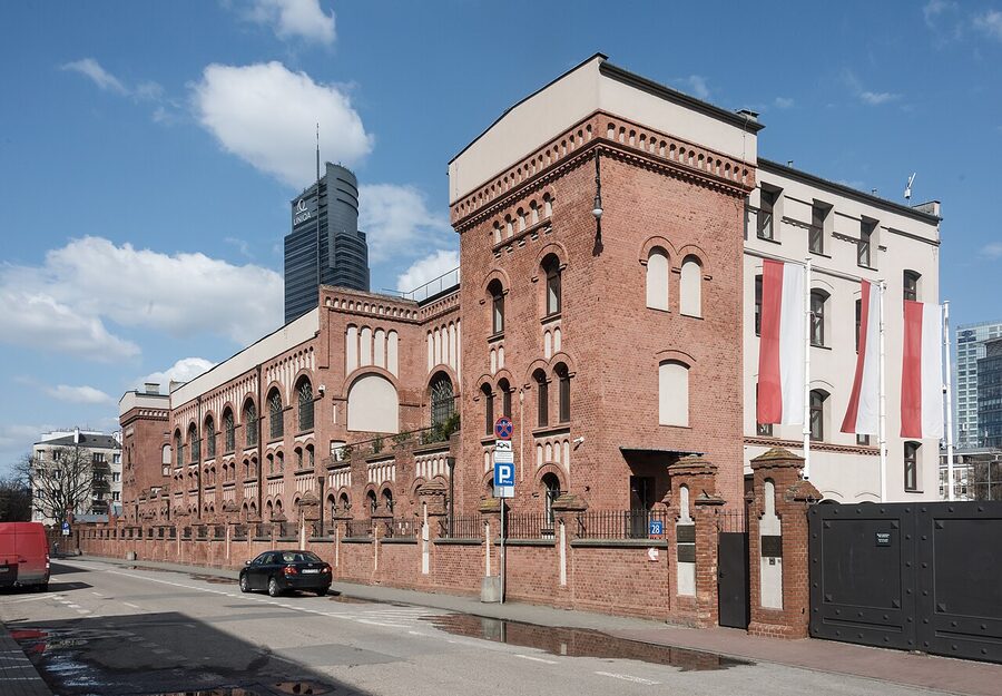 Warsaw Uprising Museum brick exterior with cobblestone forecourt