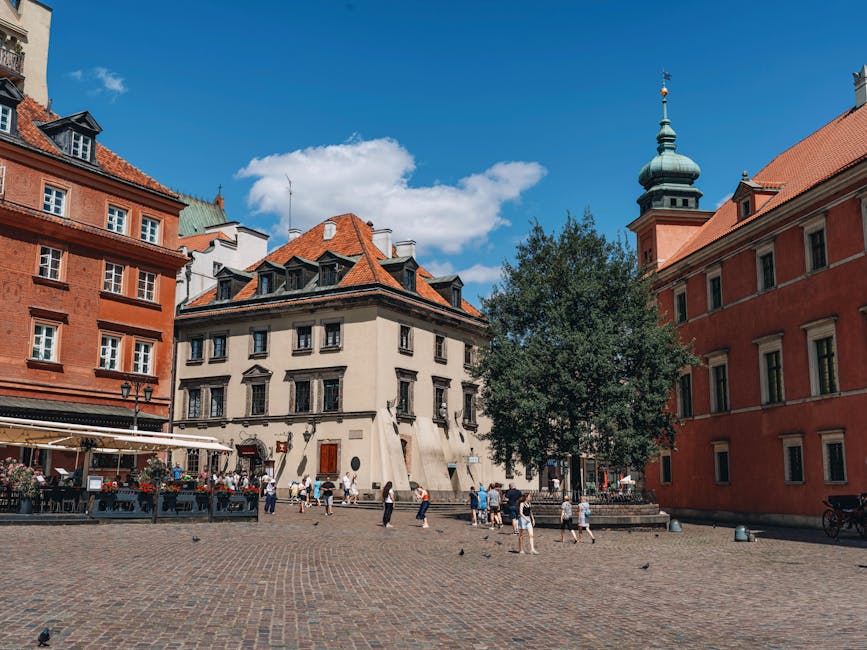 Pedestrians on cobblestone pavement in Warsaw Old Town