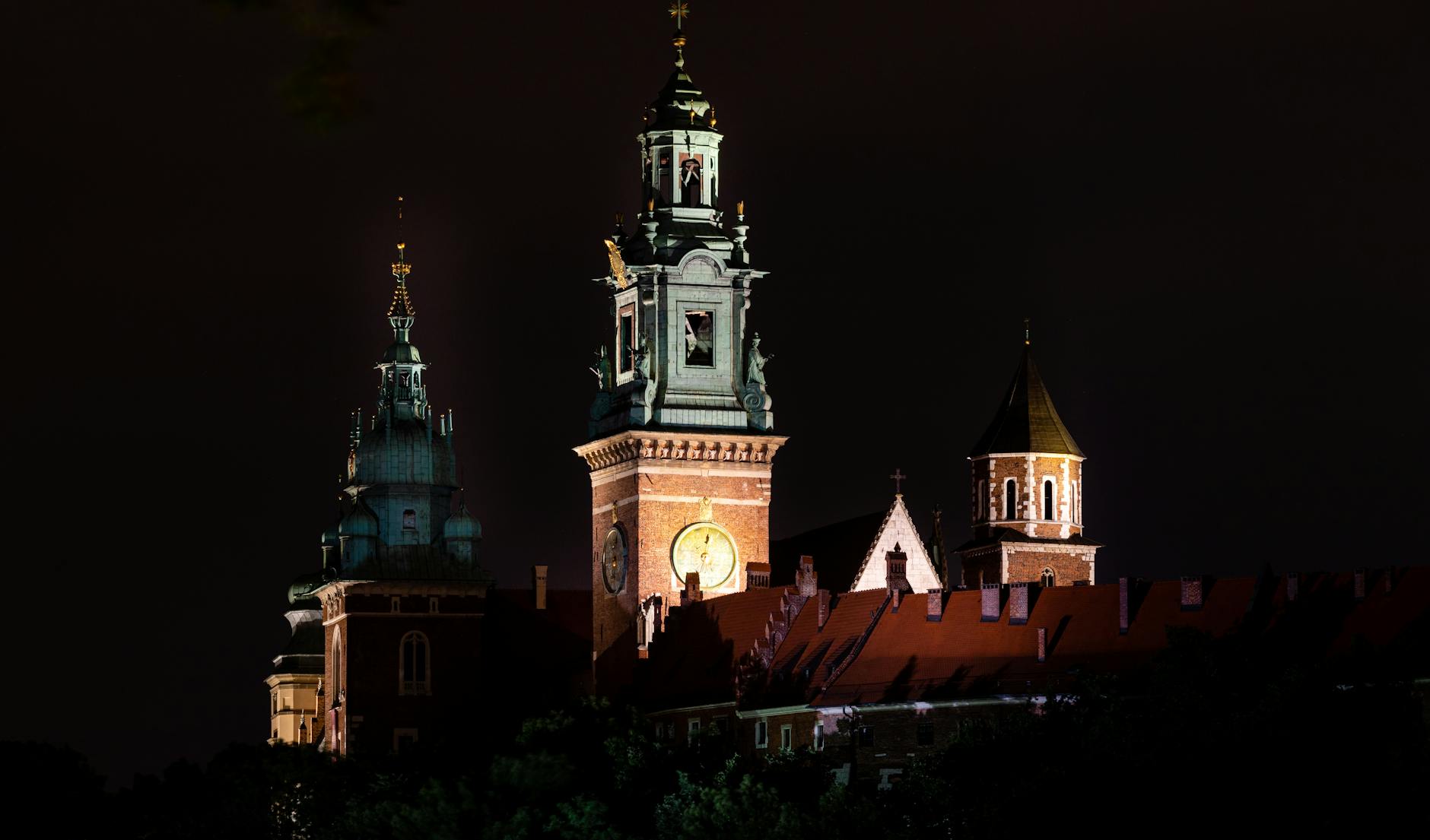 Wawel Royal Castle lit up at night in Krakow