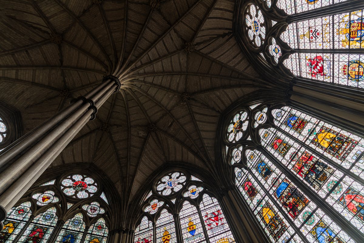 Stained glass and columns inside an English cathedral