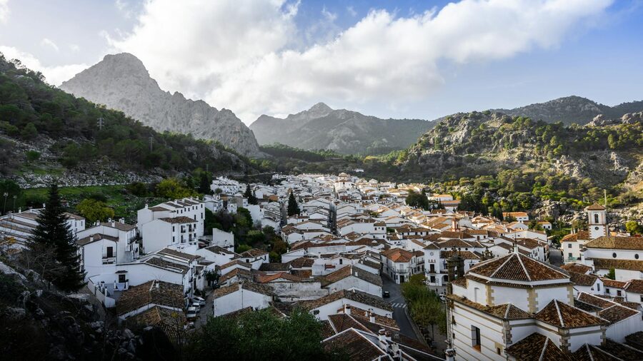 White village surrounded by mountains in Andalusia Spain