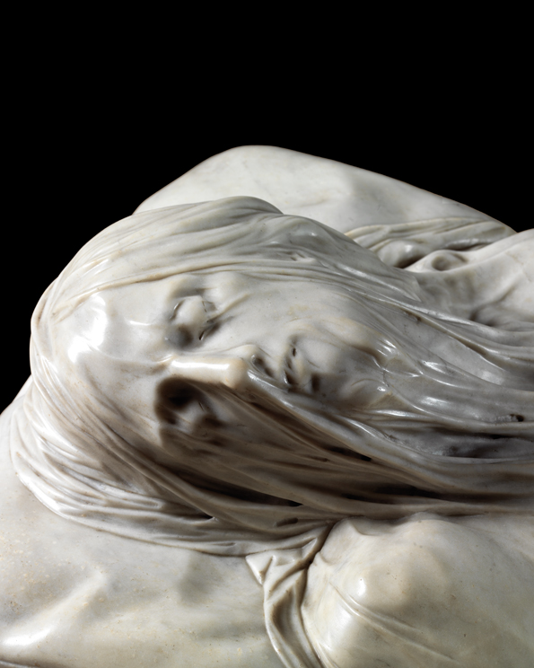 Close-up of the face of the Veiled Christ sculpture showing the marble veil detail