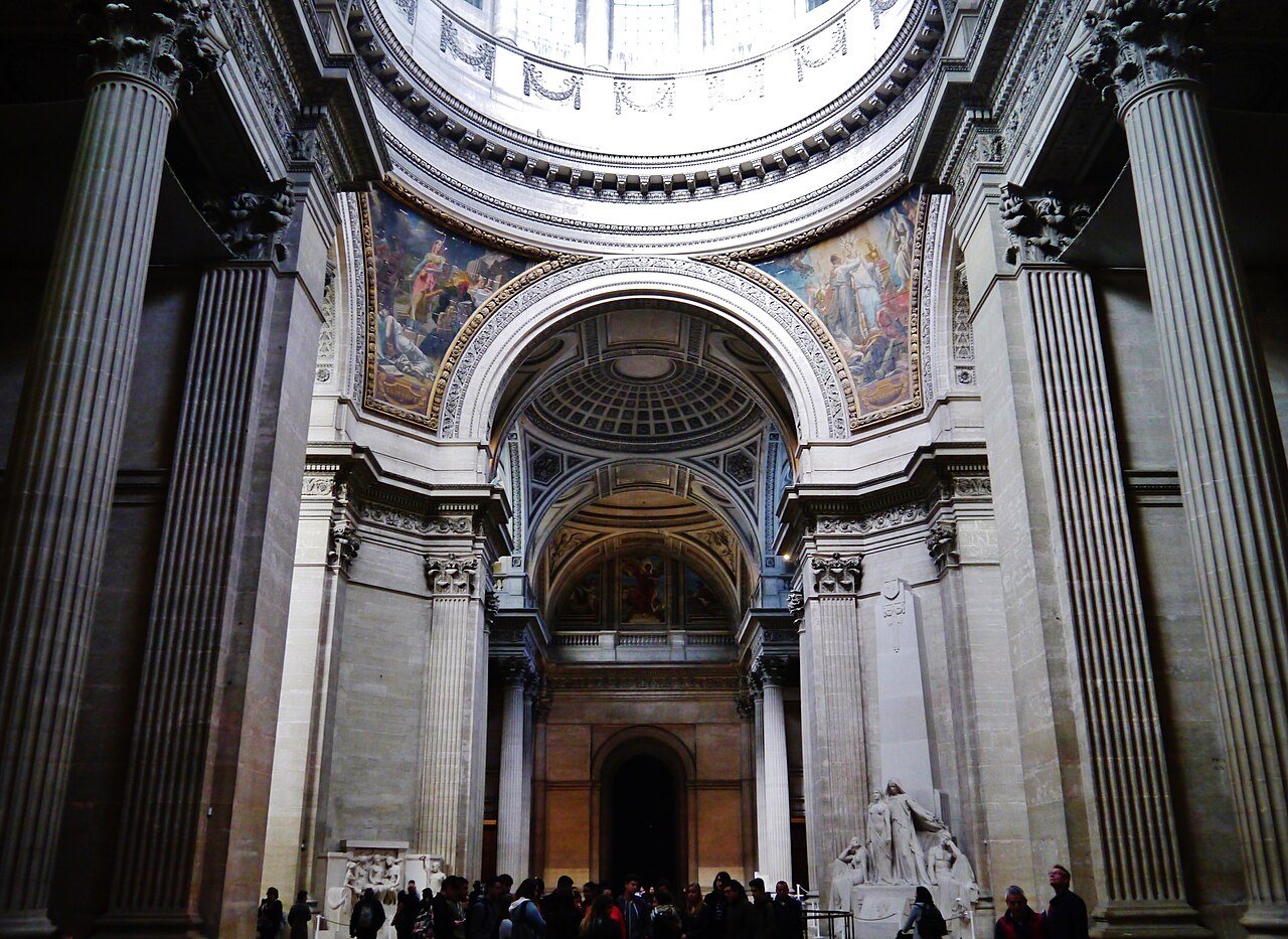 Interior of the Pantheon in Paris showing the grand nave with columns and painted ceilings