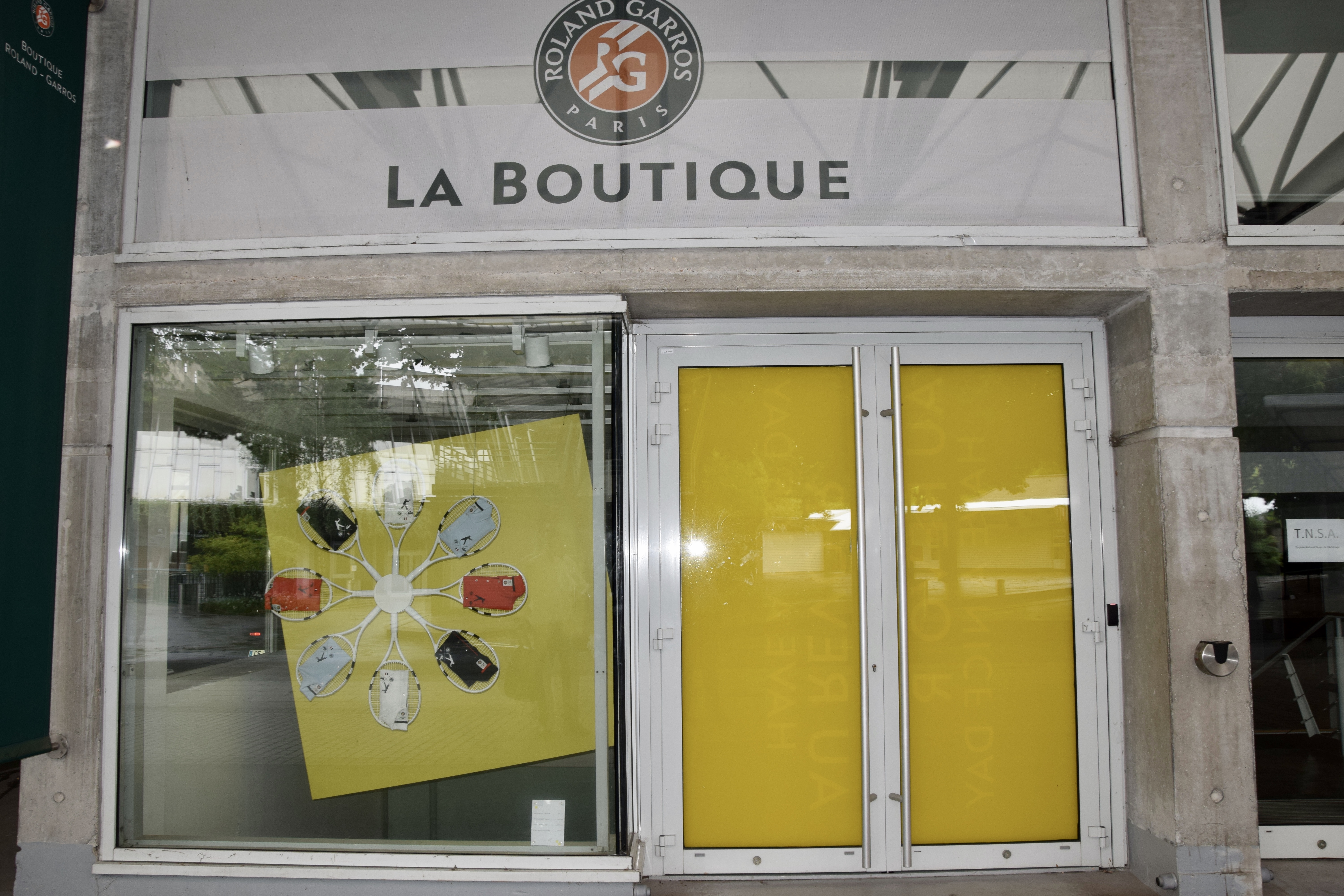 Interior of Roland Garros museum area with displays and memorabilia