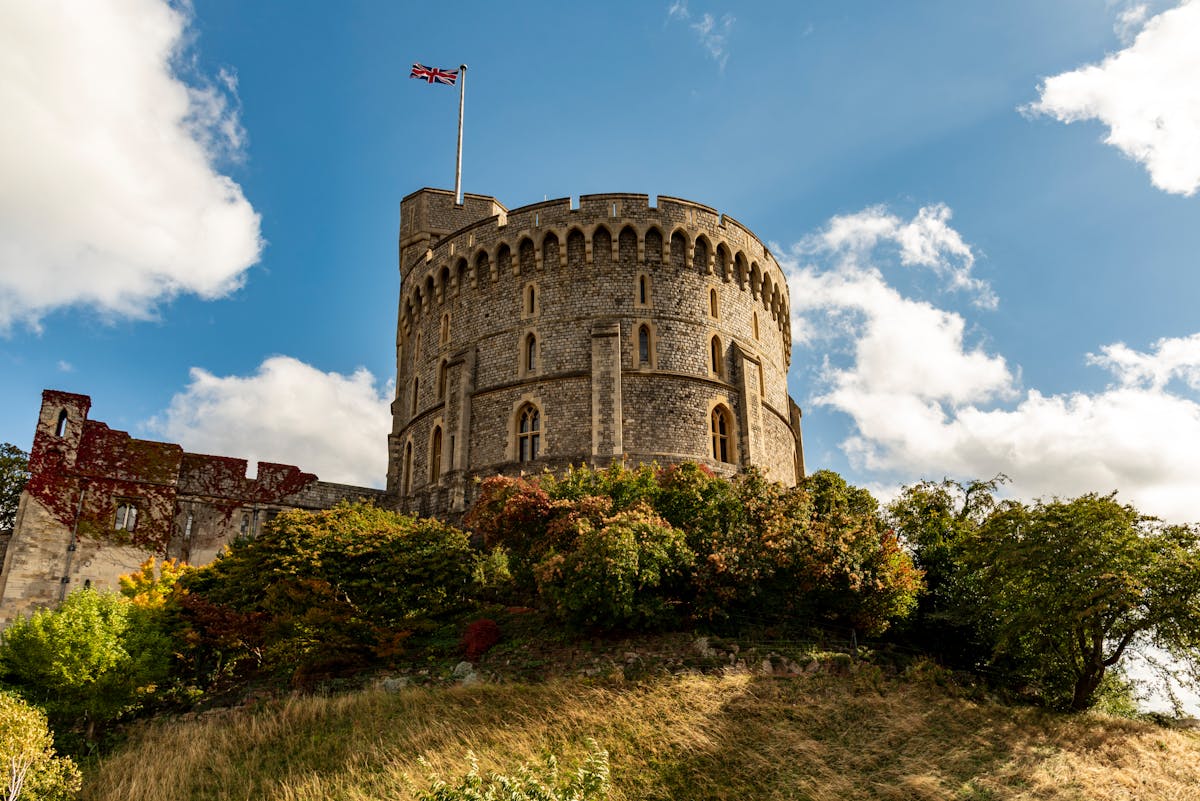 Windsor Castle surrounded by green gardens and trees