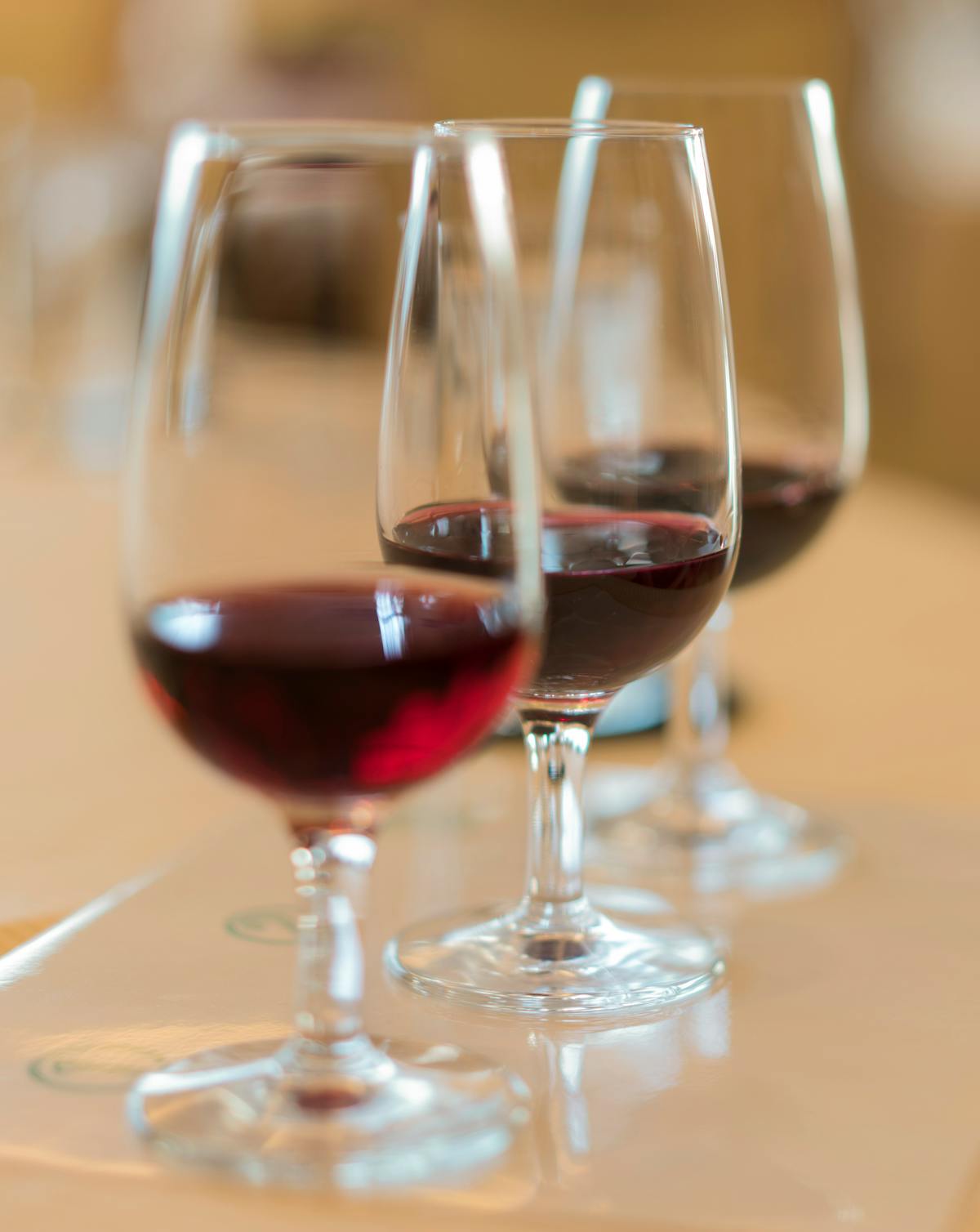Close-up of red wine glasses in an elegant setting