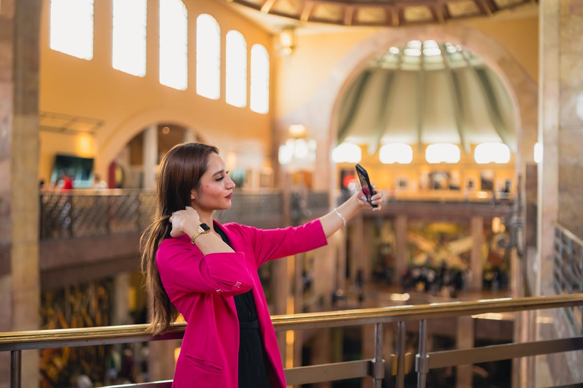 Woman taking selfie indoors at a colorful museum