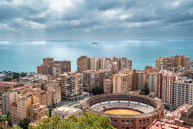 Aerial view of Malaga city and coastline with the bullring and Mediterranean Sea