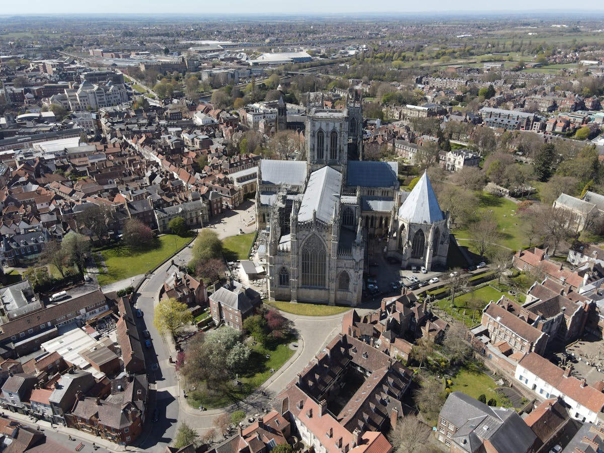 Aerial view looking down on York Minster cathedral surrounded by the historic city centre
