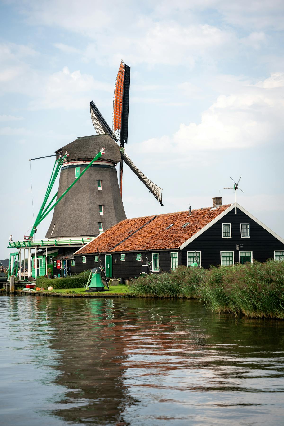 Dutch windmill beside calm water at Zaanse Schans