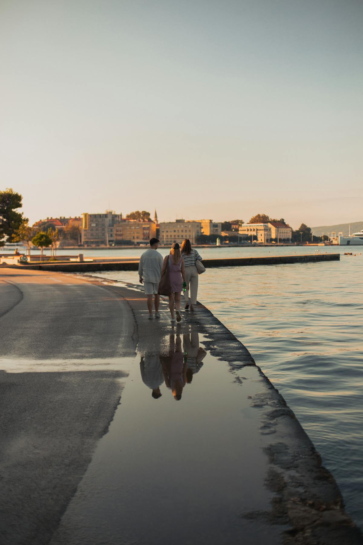 People enjoying summer evening by the sea in Zadar