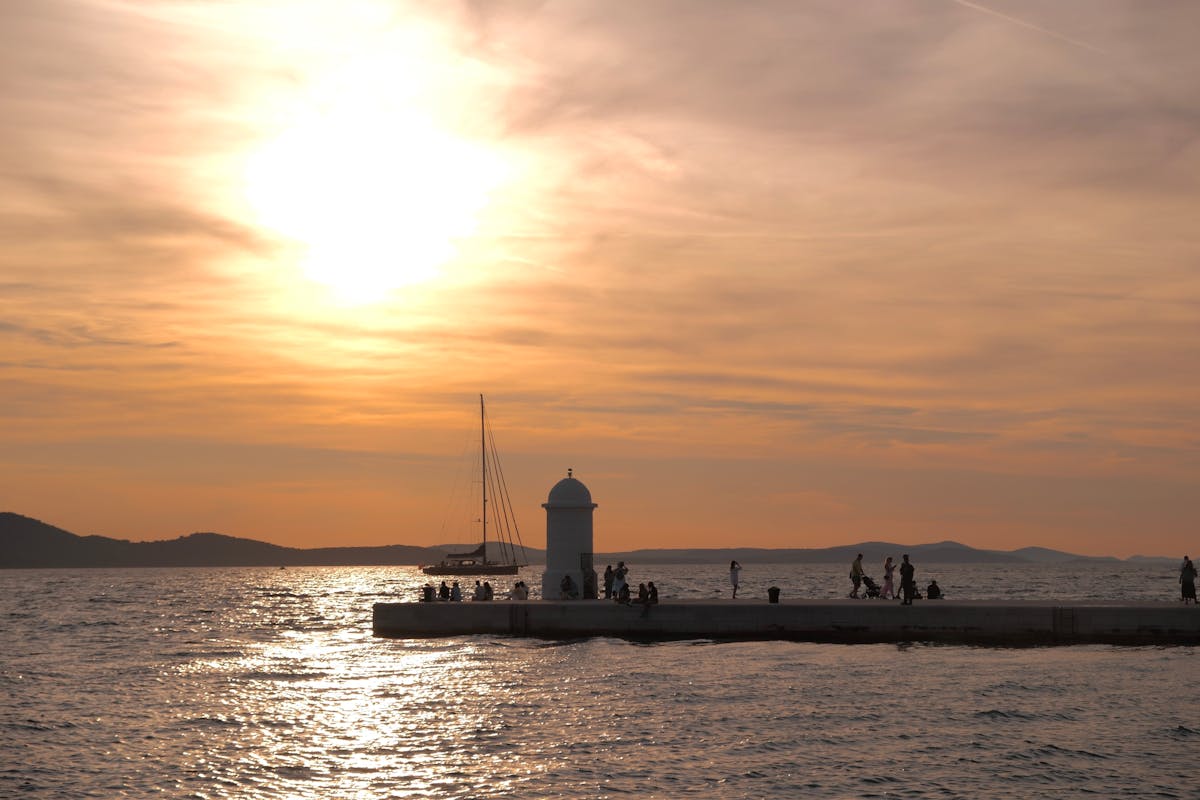 Sunset at Zadar promenade with people