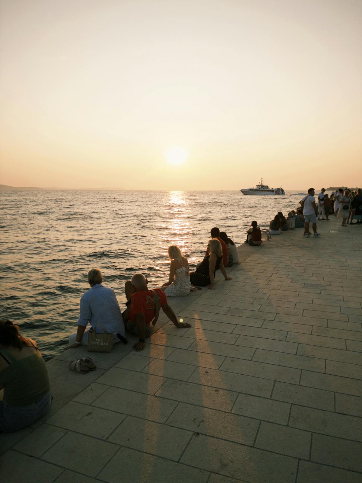 People enjoying sunset at Zadar's waterfront